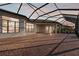 Expansive outdoor patio area with brick pavers and a screened enclosure for relaxed living at 4779 Pastel Ct, Sarasota, FL 34240