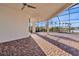 Large screened-in lanai with brick pavers and ceiling fans at 4779 Pastel Ct, Sarasota, FL 34240