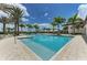 Stunning pool featuring sun loungers, lush landscaping, and clear blue water for relaxation at 4779 Pastel Ct, Sarasota, FL 34240