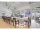 Upscale bar area with a long counter, comfortable seating, and multiple TVs for entertainment at 5107 Coral Reef Way, Bradenton, FL 34211