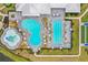 An aerial view of a community pool, featuring a splash pad, lap pool, and ample seating at 5107 Coral Reef Way, Bradenton, FL 34211