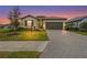 Charming single-story home with a well-manicured lawn and a two-car garage, perfect for suburban living at 5107 Coral Reef Way, Bradenton, FL 34211