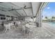 Inviting outdoor dining area by the pool with comfortable seating and a relaxed resort atmosphere at 5107 Coral Reef Way, Bradenton, FL 34211