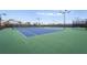 Well-maintained tennis courts with professional surfaces and nets, surrounded by landscaping and lighting at 5107 Coral Reef Way, Bradenton, FL 34211