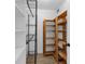 Functional pantry with wood and wire shelving at 5635 Gulf Of Mexico Dr # 103, Longboat Key, FL 34228