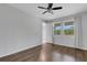 Bedroom with dark wood floors, ceiling fan and natural light at 5658 Silverbridge Trl, Bradenton, FL 34211