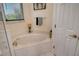Relaxing bathroom featuring corner bathtub at 6504 Copper Ridge Trl, Bradenton, FL 34201