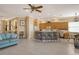 Open-concept kitchen and living area with tiled floors, a center island, and a breakfast nook at 6504 Copper Ridge Trl, Bradenton, FL 34201
