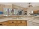 Kitchen features a large island with double sink and breakfast bar at 6504 Copper Ridge Trl, Bradenton, FL 34201
