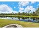 Scenic view of the pond with the trees and sky reflecting on the water at 6504 Copper Ridge Trl, Bradenton, FL 34201