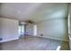 Bright living room with tile floors and ceiling fan at 66 Oakland Hills Ct, Rotonda West, FL 33947