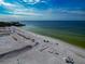 Aerial view of beach with white sand and clear water at 915 Seaside Dr # 604, Sarasota, FL 34242