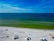 Aerial view of beach showing white sand and blue water at 915 Seaside Dr # 604, Sarasota, FL 34242