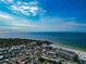 Aerial view of beachfront community, highlighting its proximity to the ocean and local businesses at 915 Seaside Dr # 604, Sarasota, FL 34242
