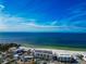 Aerial view of beachfront property, showcasing ocean views and nearby amenities at 915 Seaside Dr # 604, Sarasota, FL 34242