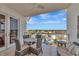 Outdoor seating on balcony provides the perfect place to relax and enjoy scenic views at 915 Seaside Dr # 604, Sarasota, FL 34242