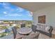 Relaxing balcony featuring comfortable seating and city views at 915 Seaside Dr # 604, Sarasota, FL 34242