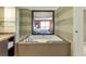 Relaxing bathroom with a luxurious soaking tub and a view of the bedroom at 915 Seaside Dr # 604, Sarasota, FL 34242