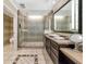 Bathroom with walk-in shower and large vanity at 915 Seaside Dr # 604, Sarasota, FL 34242