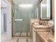 Modern bathroom with a glass enclosed shower and granite vanity at 915 Seaside Dr # 604, Sarasota, FL 34242