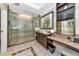 Large walk-in shower, vanity with double sinks, and modern fixtures at 915 Seaside Dr # 604, Sarasota, FL 34242