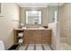 Modern bathroom with wood vanity and walk-in shower at 915 Seaside Dr # 604, Sarasota, FL 34242