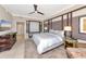 Spacious Primary bedroom with king-size bed and flat-screen TV at 915 Seaside Dr # 604, Sarasota, FL 34242