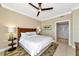 King-size bed and mounted TV in a bright and comfortable bedroom at 915 Seaside Dr # 604, Sarasota, FL 34242