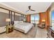 King-size bed, sitting area, and large windows with city view at 915 Seaside Dr # 604, Sarasota, FL 34242