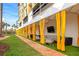 Private cabanas with comfortable seating and yellow curtains at 915 Seaside Dr # 604, Sarasota, FL 34242