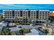 A full exterior view of the condo, showing multiple stories and ocean views at 915 Seaside Dr # 604, Sarasota, FL 34242