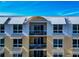 Exterior view shows multiple stories and multiple balconies with awnings at 915 Seaside Dr # 604, Sarasota, FL 34242