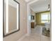 Bright hallway with mirror and view into bedroom at 915 Seaside Dr # 604, Sarasota, FL 34242