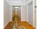 Long hallway with patterned carpet and neutral walls at 915 Seaside Dr # 604, Sarasota, FL 34242