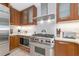 Gourmet kitchen featuring stainless steel appliances, custom cabinets, and white countertops at 915 Seaside Dr # 604, Sarasota, FL 34242