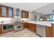 Bright kitchen with stainless steel appliances, a gas cooktop, and abundant counter space at 915 Seaside Dr # 604, Sarasota, FL 34242