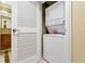 Stackable washer and dryer in a small laundry room at 915 Seaside Dr # 604, Sarasota, FL 34242