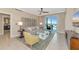 Comfortable living room with sliding glass doors to the balcony, tile flooring and modern décor at 915 Seaside Dr # 604, Sarasota, FL 34242
