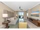 Inviting living room with sliding glass doors to the balcony, tile flooring and upscale furnishings at 915 Seaside Dr # 604, Sarasota, FL 34242