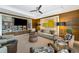 Relaxing lounge area with comfortable seating and a large TV at 915 Seaside Dr # 604, Sarasota, FL 34242