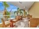 Outdoor patio with wicker furniture and ocean views at 915 Seaside Dr # 604, Sarasota, FL 34242