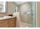 Spa-like shower with patterned tile and rainfall showerhead at 915 Seaside Dr # 604, Sarasota, FL 34242