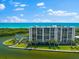 Waterfront property with tennis court and lush landscaping at 9397 Midnight Pass Rd # 906, Sarasota, FL 34242