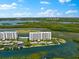 Aerial view of waterfront property with resort-style amenities at 9397 Midnight Pass Rd # 906, Sarasota, FL 34242