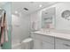 Modern bathroom with white vanity and walk-in shower at 9397 Midnight Pass Rd # 906, Sarasota, FL 34242