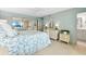 Spacious bedroom with a queen-size bed and mirrored closet at 9397 Midnight Pass Rd # 906, Sarasota, FL 34242