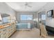 Bedroom with twin bed, dresser, and desk at 9397 Midnight Pass Rd # 906, Sarasota, FL 34242