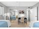 Bedroom with twin beds, desk, and mirrored closet at 9397 Midnight Pass Rd # 906, Sarasota, FL 34242