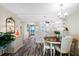 Bright dining area with table and chairs, open to kitchen at 9397 Midnight Pass Rd # 906, Sarasota, FL 34242
