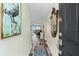 Bright condo entryway with mirror and view to living area at 9397 Midnight Pass Rd # 906, Sarasota, FL 34242